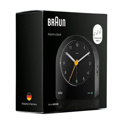 Braun Classic Analogue Alarm Clock, Black, Quiet Quartz Movement, Crescendo Beep, Snooze & Backlight, Model BC22B - in use