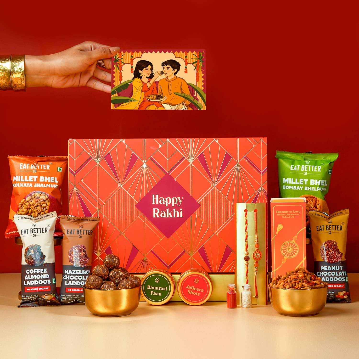 Eat Better Co Sneh Rakhi Gift Hamper for Brother, 11 Items, 2 Rakhis, Chocolate Laddoos, Millet Bhel, Roli-Chawal, Mukhwas