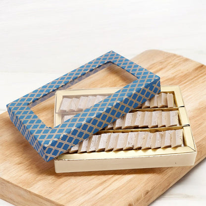 Ghasitaram Gifts Jaiccha Rakhi Gifts for Brothers Rakhi Sweets Mini Kaju Katli Blue Box with Om Rakhi - packaging