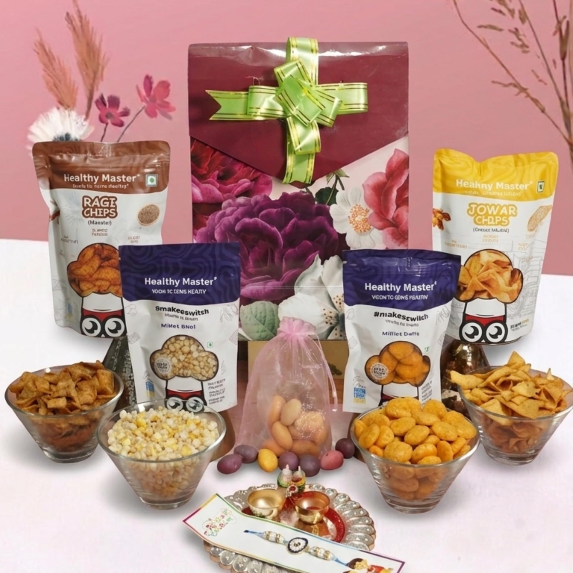 Healthy Master 8-Item Rakhi Gift Hamper with Rakhi, Greeting Card, Chikki, Eraser Chocolate & Kumkum Chawal | Traditional Rak