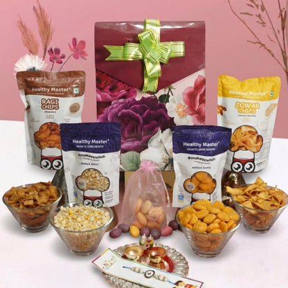 Healthy Master 8-Item Rakhi Gift Hamper with Rakhi, Greeting Card, Chikki, Eraser Chocolate & Kumkum Chawal | Traditional Rak
