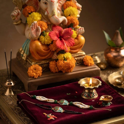 MOTI MALA Elegant Lotus Rakhi and Matching Bracelet with Decorative Pearl Beads - front view