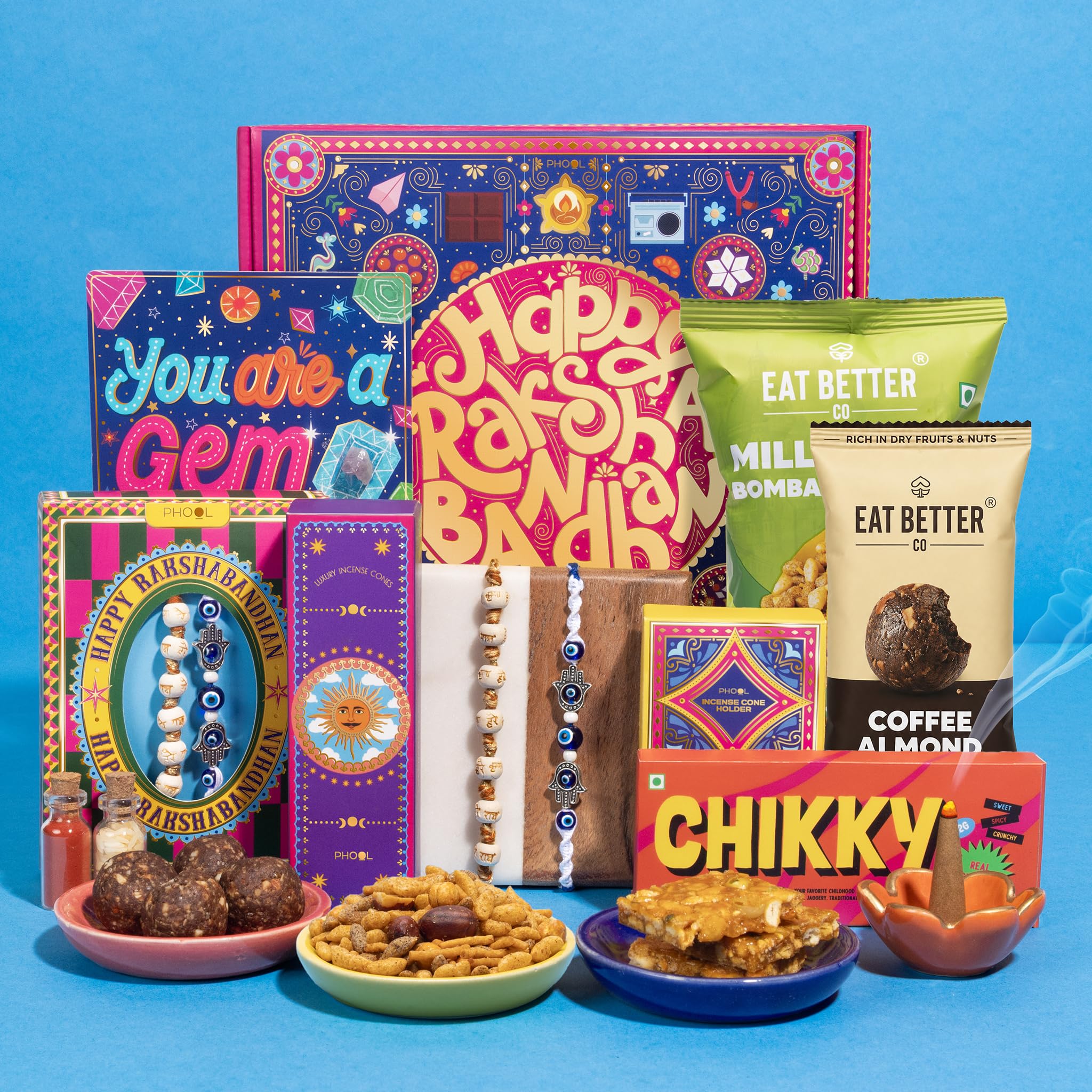 Phool Bandhan Rakhi Gift Hamper for Brother | 10-Item Rakhi Gift Set with 2 Rakhis, Incense, Laddoo & Chikki | Rakhi Gift Box