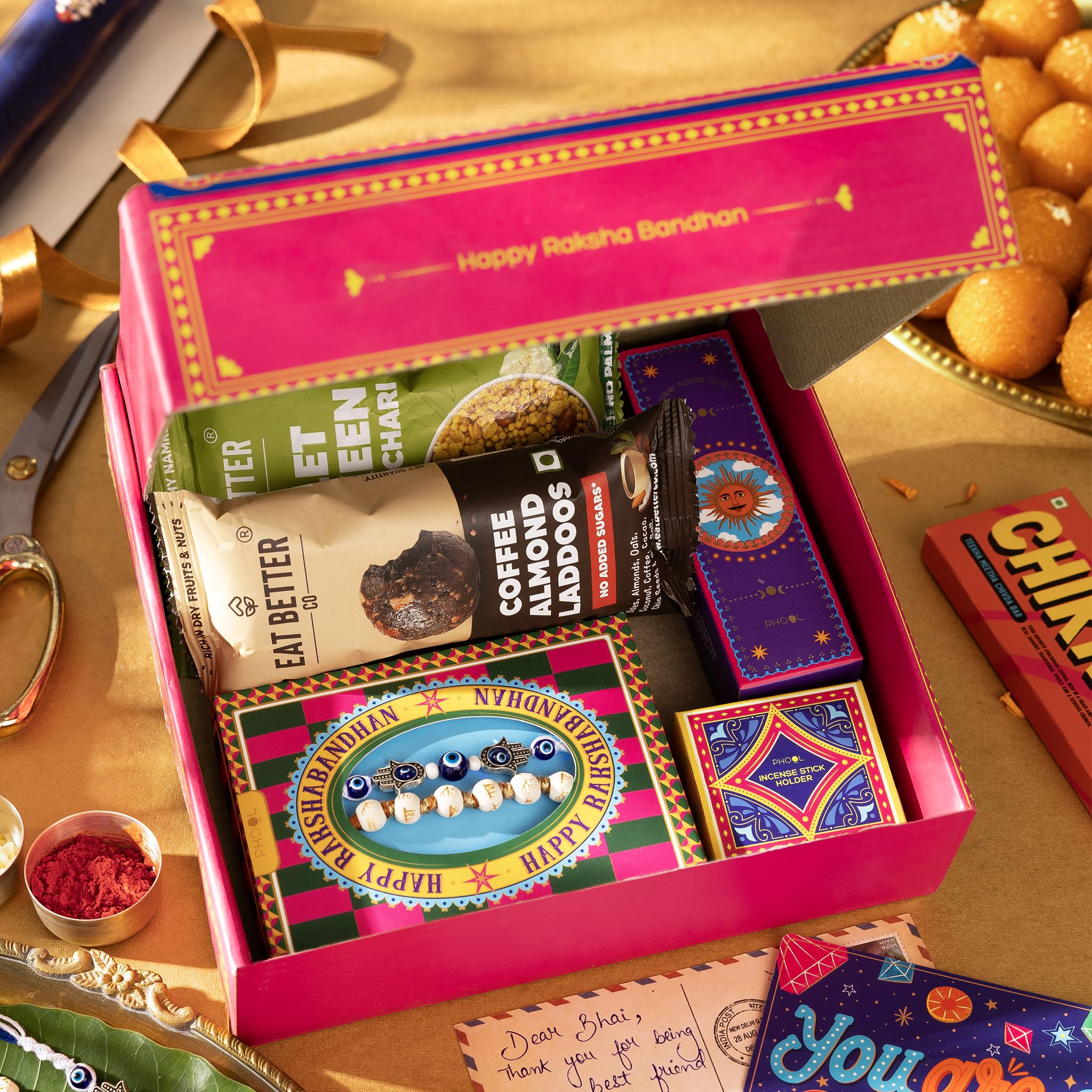 Phool Bandhan Rakhi Gift Hamper for Brother | 10-Item Rakhi Gift Set with 2 Rakhis, Incense, Laddoo & Chikki | Rakhi Gift Box
