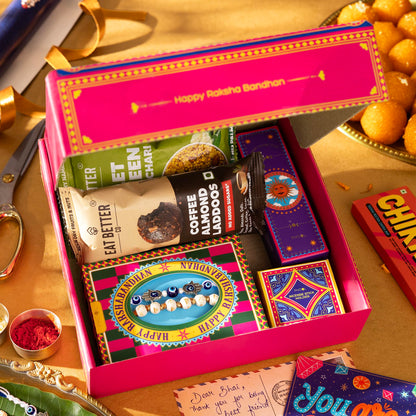 Phool Bandhan Rakhi Gift Hamper for Brother | 10-Item Rakhi Gift Set with 2 Rakhis, Incense, Laddoo & Chikki | Rakhi Gift Box