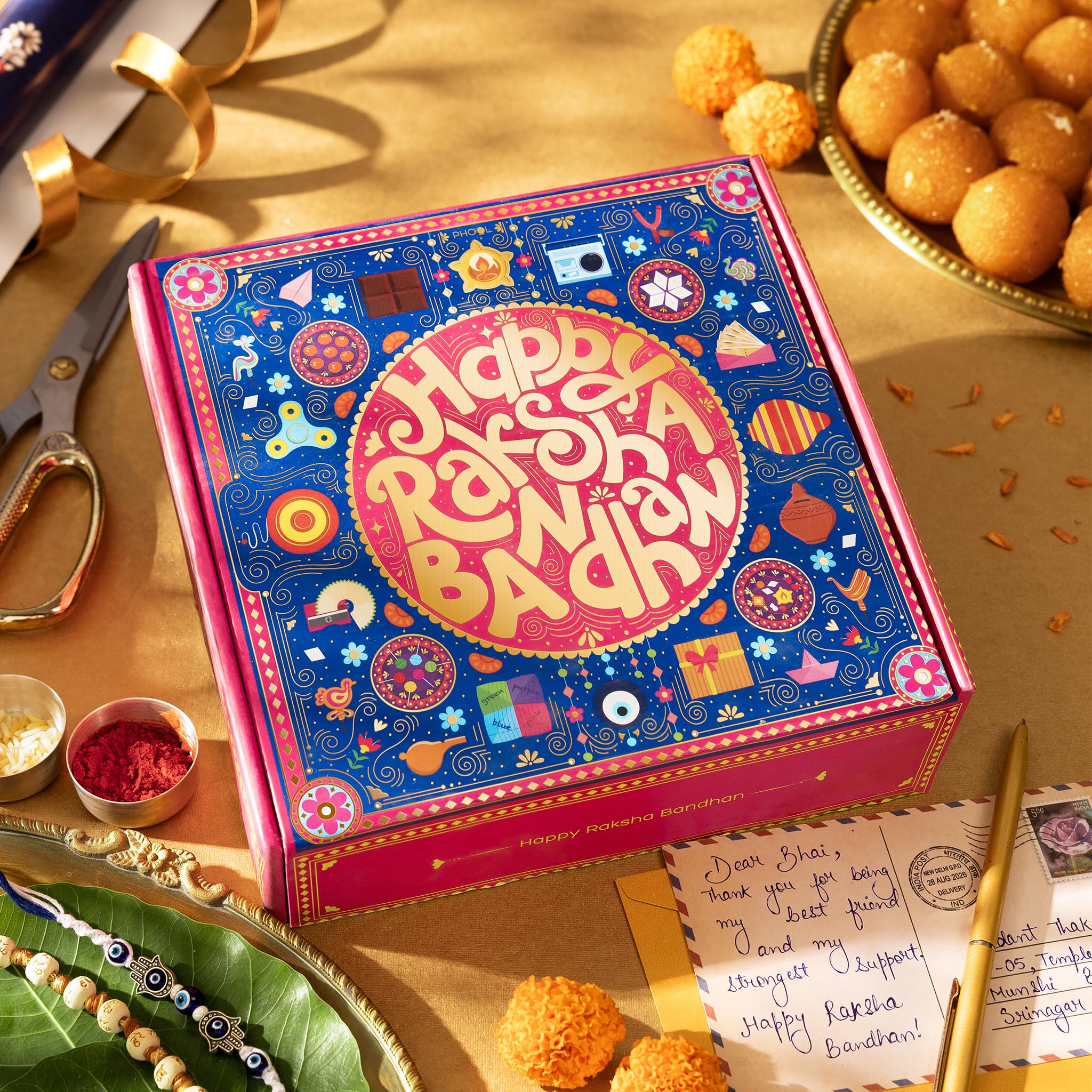 Phool Bandhan Rakhi Gift Hamper for Brother | 10-Item Rakhi Gift Set with 2 Rakhis, Incense, Laddoo & Chikki | Rakhi Gift Box