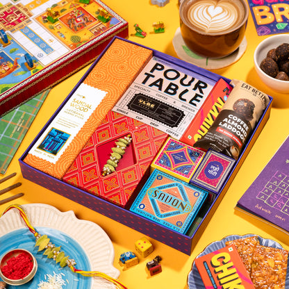 Phool Ludo Rakhi Gift Hamper for Brother | 13-Item Rakhi Gift Box with Elaichi Rakhi, Coffee, Laddoo, Chikki, Soap & Ludo Gam