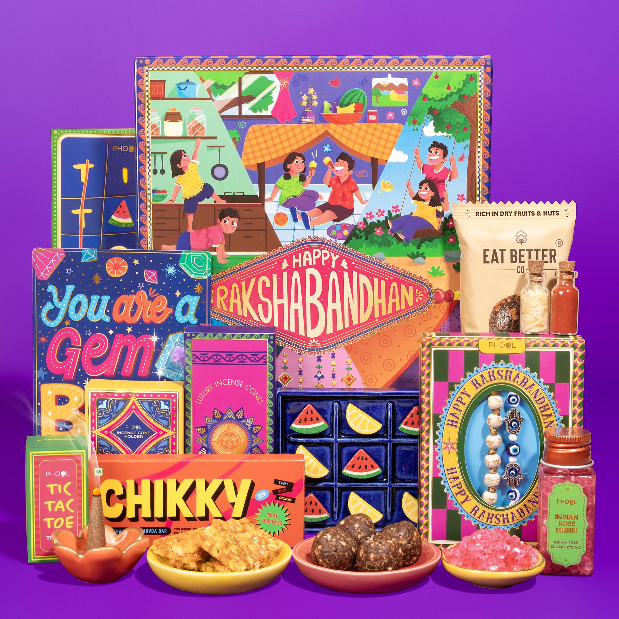 Phool Nostalgia Rakhi Gift Hamper for Brother | 11-Item Rakhi Gift Box with 2 Rakhis, Tic Tac Toe, Incense, Laddoo & Chikki |