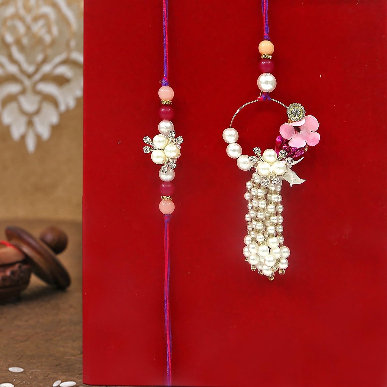 UPHARKARO Elegant Pearl Floral Bhaiya Bhabhi Lumba Rakhi Set with Tassel & Pink Crystal Design - label detail